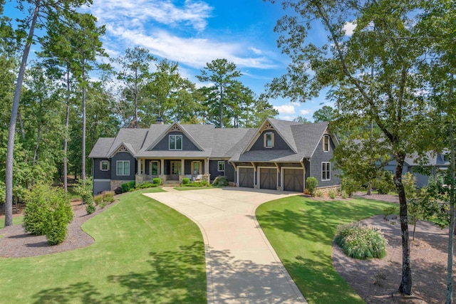 craftsman inspired home with a porch, a garage, and a front lawn