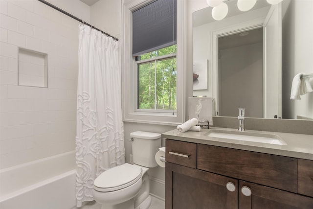 full bathroom featuring shower / bath combination with curtain, vanity, and toilet