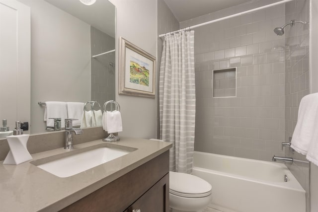 full bathroom with vanity, shower / bath combination with curtain, and toilet