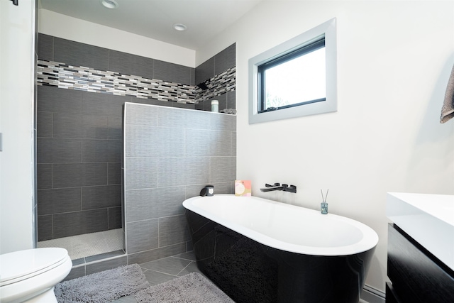 bathroom featuring tile patterned flooring, shower with separate bathtub, and toilet