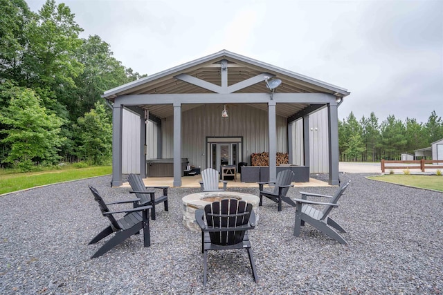 view of patio / terrace featuring an outdoor fire pit