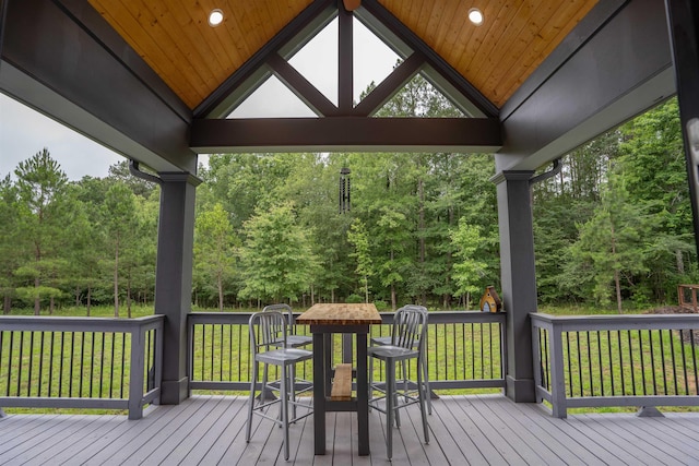 wooden deck featuring a yard