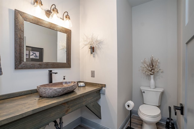 bathroom with sink and toilet