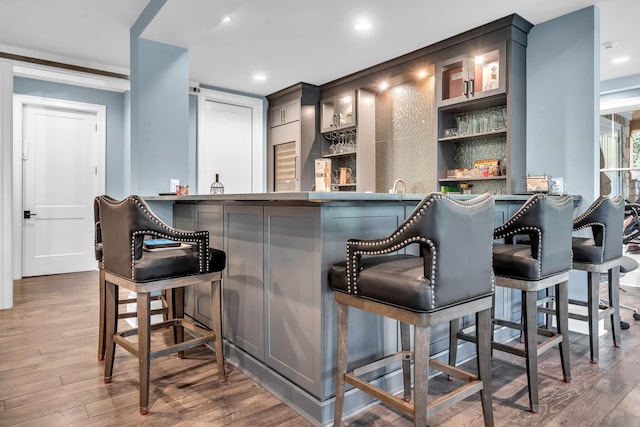 1191 Sugar Run, Greensboro, GA 30642 - indoor wet bar featuring wood finished floors and recessed lighting