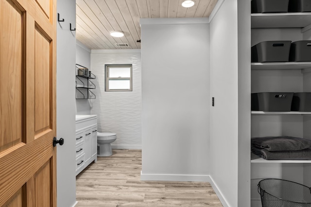 bathroom with vanity, wood finished floors, toilet, and wooden ceiling
