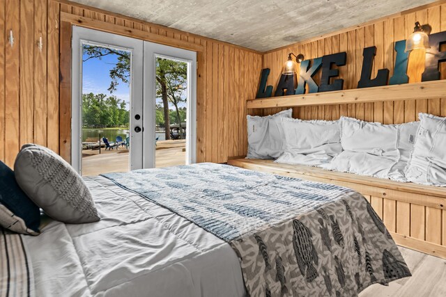 307 Lakeview Dr, Milledgeville, GA 31061 - bedroom featuring access to exterior, wood walls, wood finished floors, french doors, and wooden ceiling