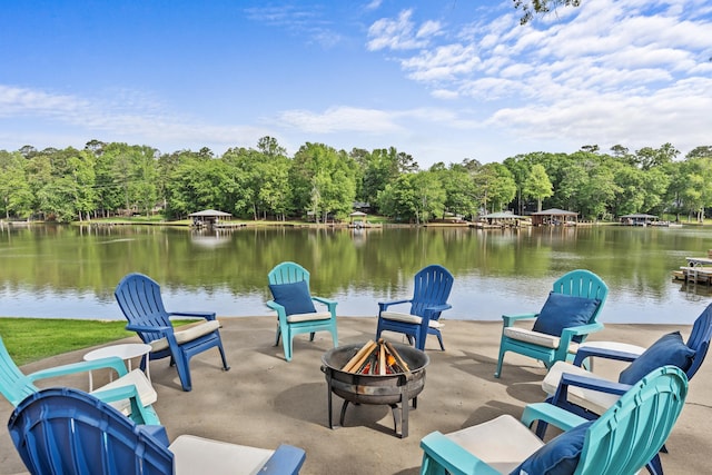 view of patio / terrace with a water view and a fire pit