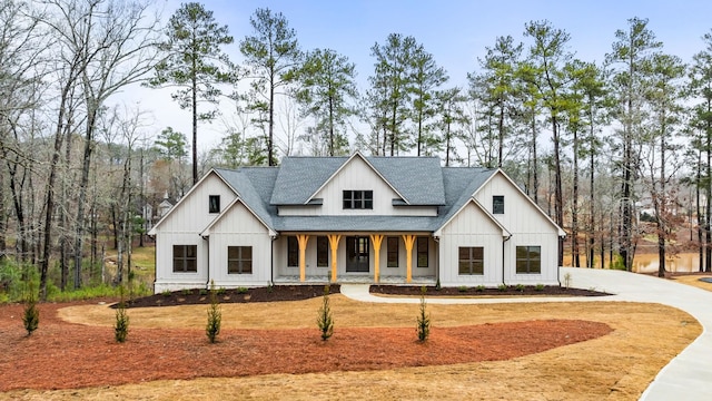 1050 Carnoustie Dr, Greensboro, GA 30642 - modern farmhouse with a shingled roof, a porch, and driveway