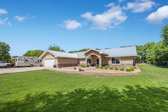 view of front of house with a front yard and a garage