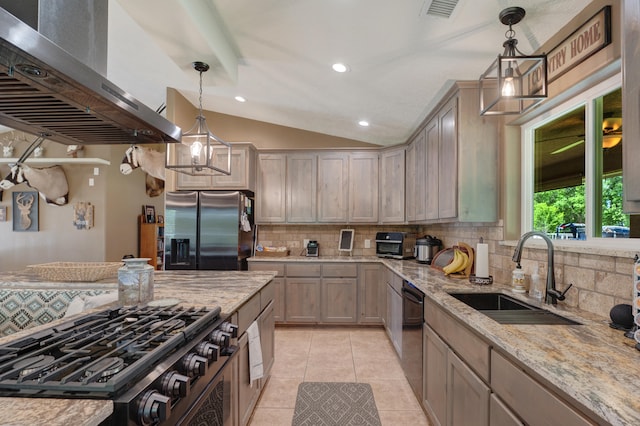 kitchen with wall chimney range hood, stainless steel fridge with ice dispenser, tasteful backsplash, hanging light fixtures, and sink