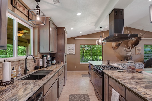 kitchen featuring pendant lighting, light stone countertops, vaulted ceiling, island exhaust hood, and sink