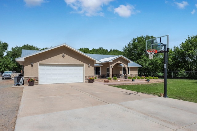 single story home featuring a front lawn and a garage