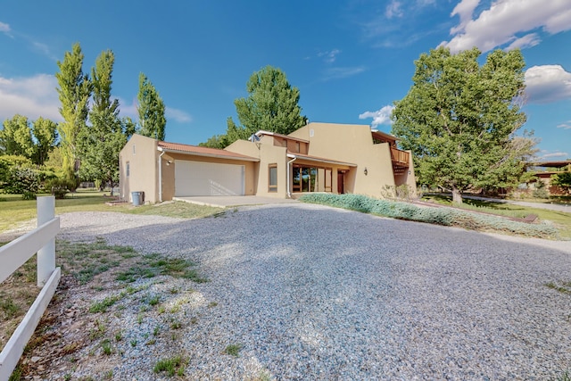 adobe home featuring a garage