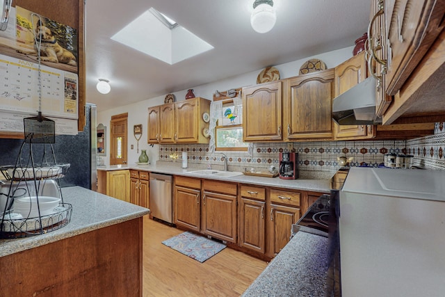 kitchen featuring sink, light hardwood / wood-style flooring, dishwasher, wall chimney range hood, and tasteful backsplash