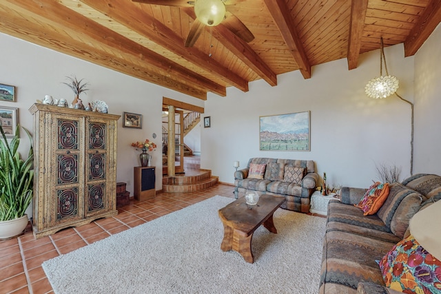 tiled living room with beamed ceiling, wood ceiling, and ceiling fan with notable chandelier