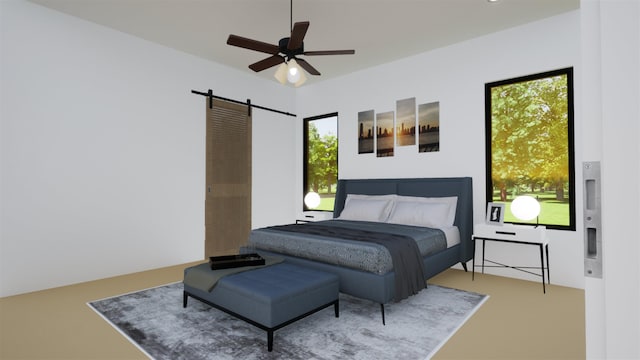 bedroom with a barn door and ceiling fan