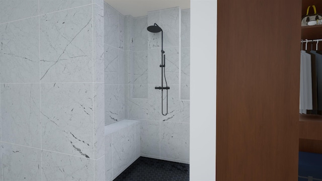 bathroom with a tile shower