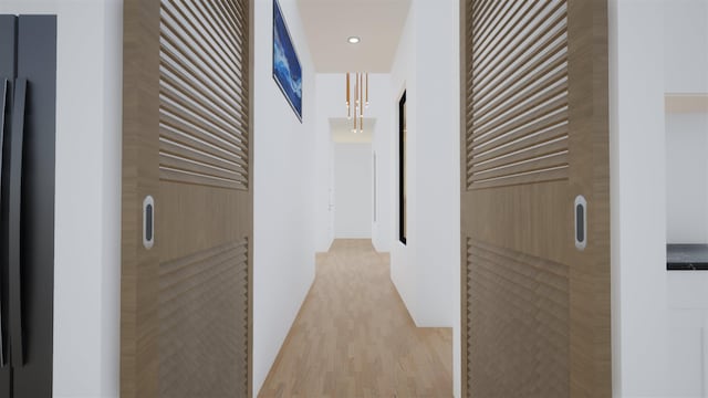 hallway with light hardwood / wood-style floors