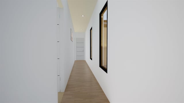 hallway with light hardwood / wood-style flooring