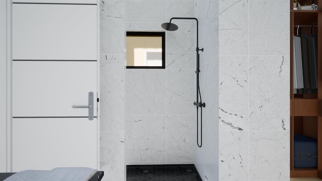 bathroom with a tile shower