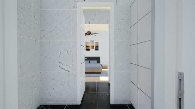 hallway featuring tile walls