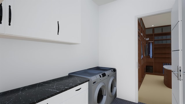 laundry room with cabinets and separate washer and dryer