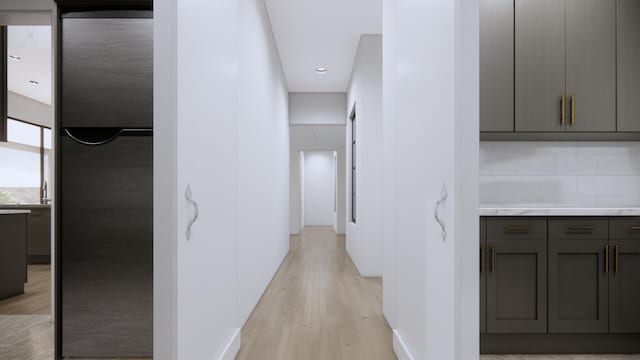 hallway with light hardwood / wood-style flooring