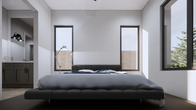 bedroom featuring multiple windows, sink, and ensuite bathroom