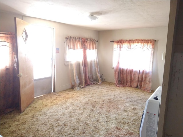 empty room with light colored carpet