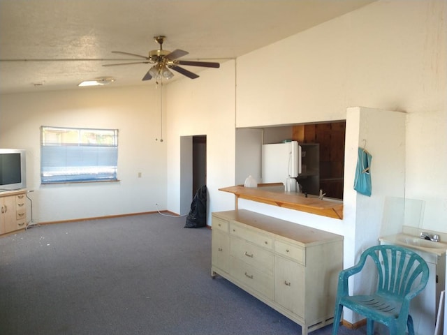 carpeted bedroom with ceiling fan, white fridge, and lofted ceiling