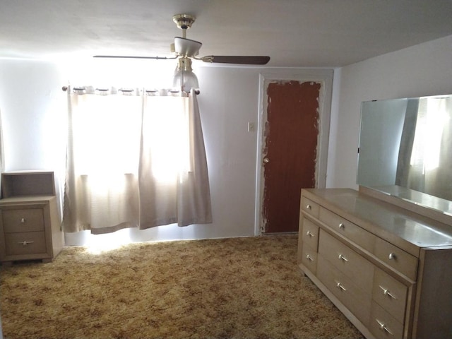 unfurnished bedroom featuring ceiling fan and light colored carpet