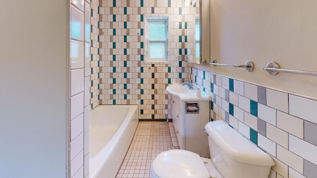 full bathroom featuring tiled shower / bath combo, vanity, tile walls, tile floors, and toilet