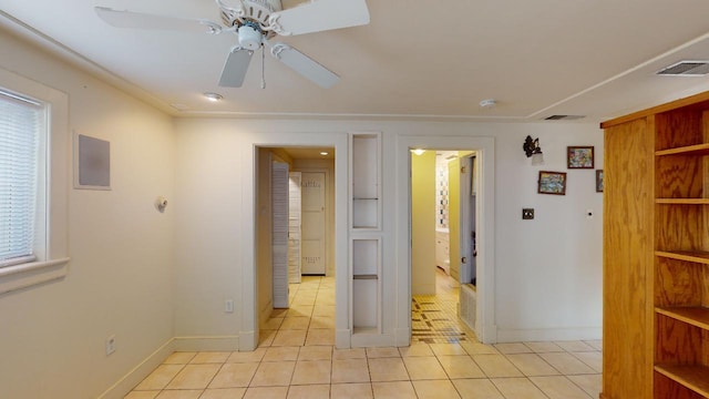 unfurnished room with ceiling fan and light tile floors