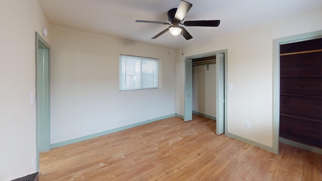 unfurnished bedroom with ceiling fan and light wood-type flooring