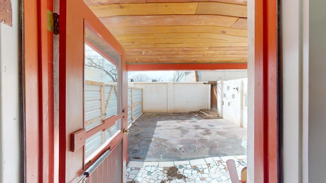 exterior space with wood ceiling and vaulted ceiling