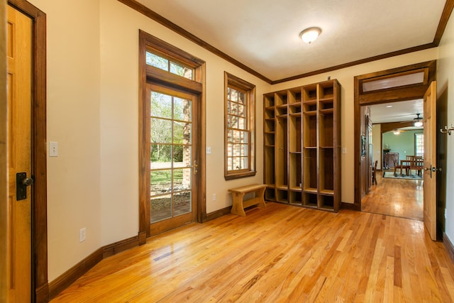 interior space featuring crown molding and light wood-type flooring