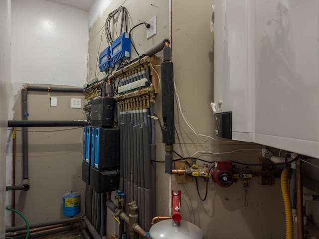 utility room with water heater