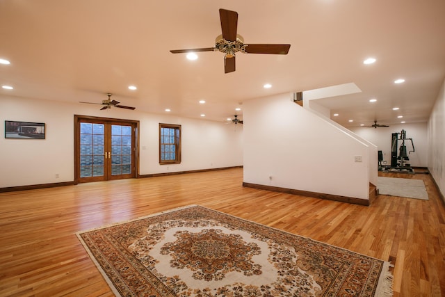 living room with light hardwood / wood-style flooring and french doors