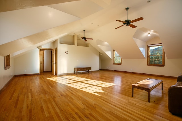 additional living space featuring vaulted ceiling, ceiling fan, and light hardwood / wood-style floors