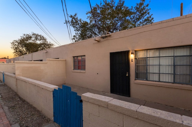 view of property exterior at dusk