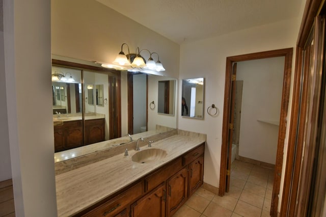 bathroom with tile patterned floors and vanity