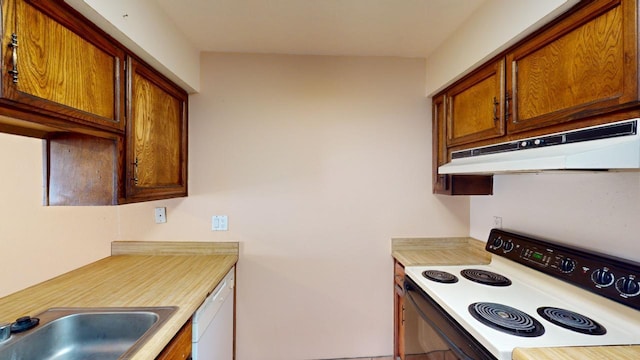 kitchen featuring sink and white appliances