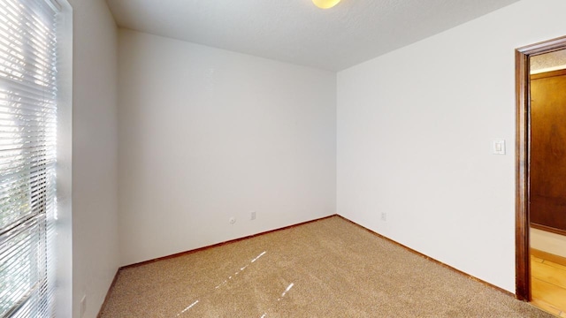 empty room with light colored carpet