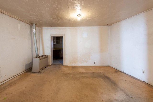 unfurnished room with radiator