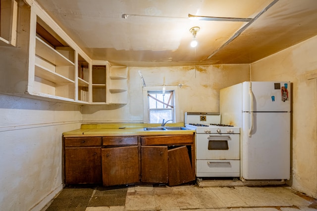 kitchen with white appliances and sink