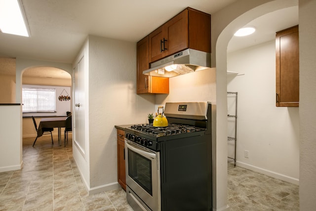 kitchen with stainless steel range with gas cooktop