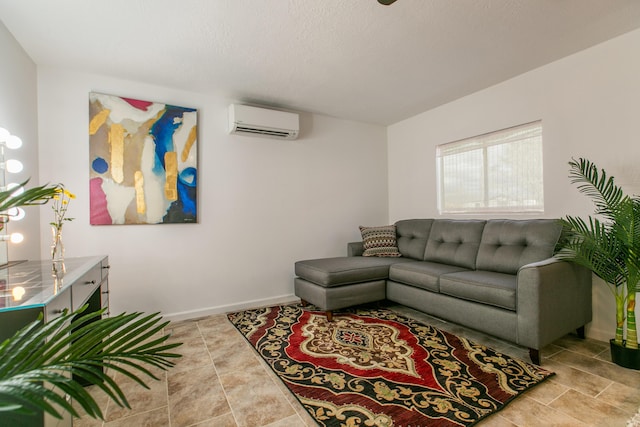 living room featuring light tile patterned flooring, a wall mounted AC, and a textured ceiling