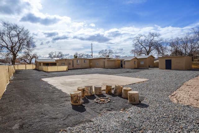 view of yard with a patio and a storage shed