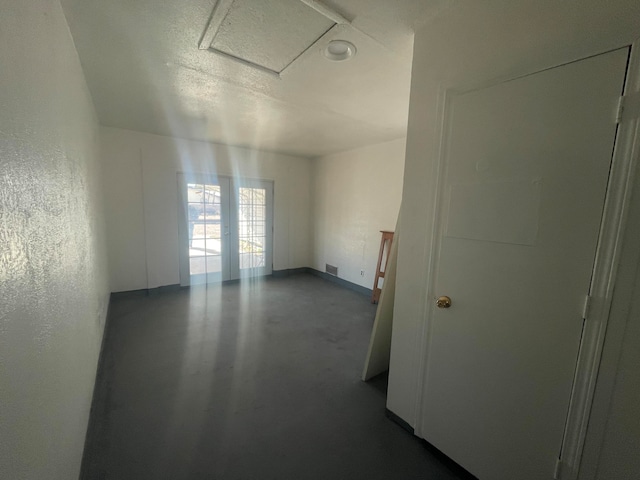 empty room featuring a textured ceiling