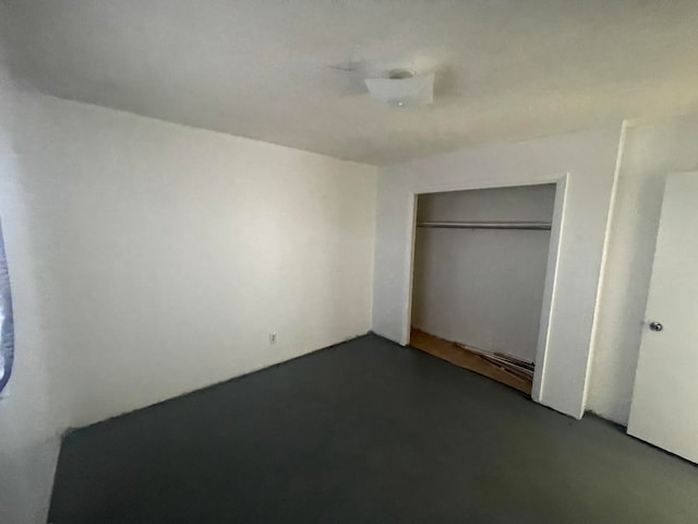 unfurnished bedroom with a closet